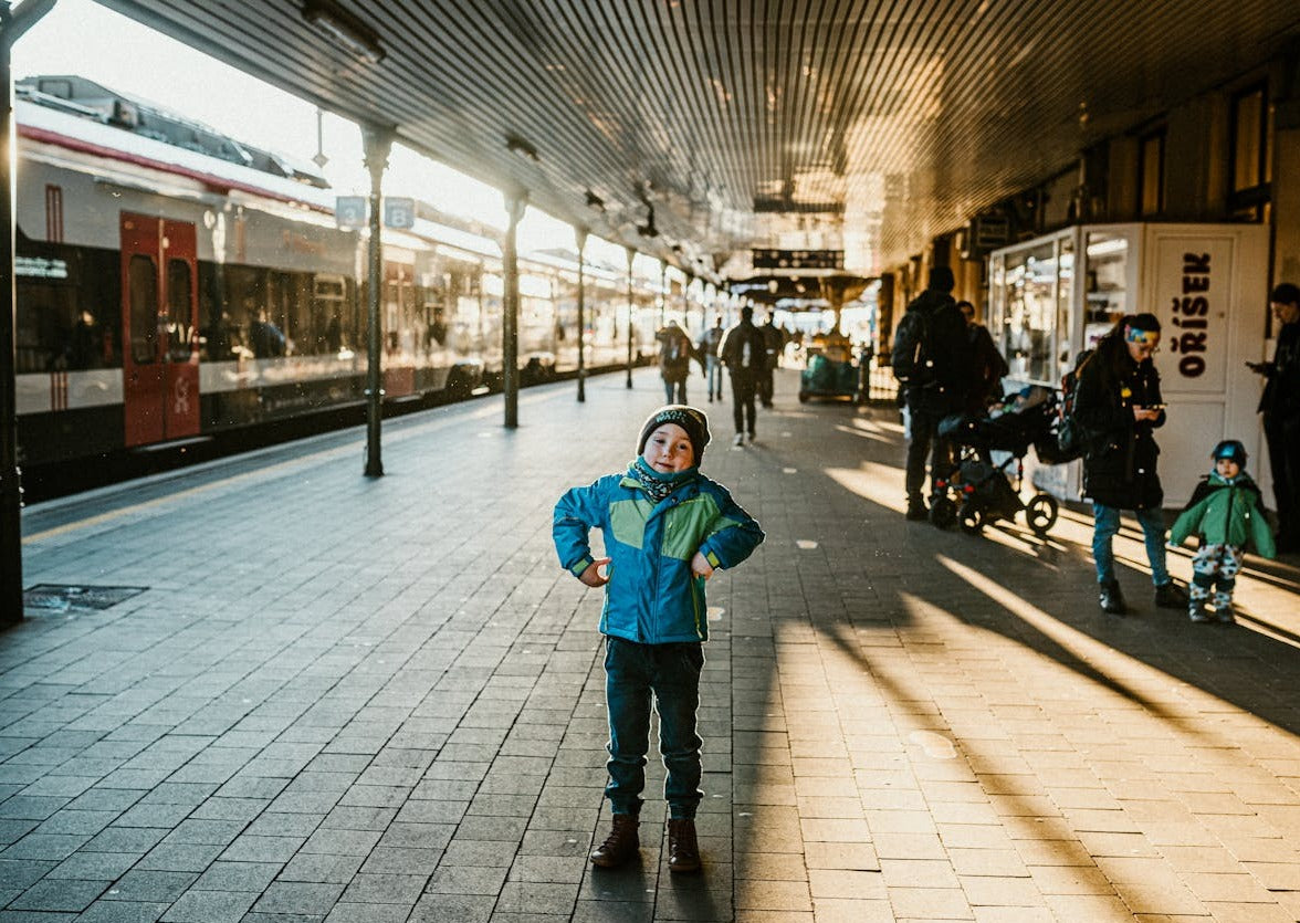 Child in a train station